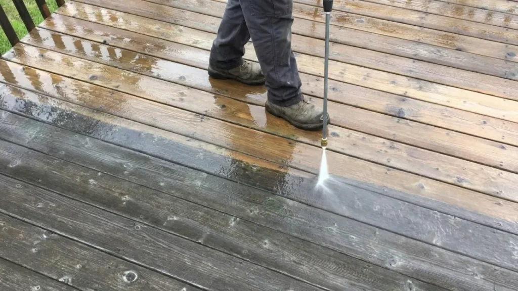 deck cleaning on outdoor wooden deck boards.